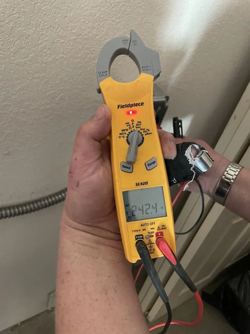 Voltage testing with clamp meter during Ceiling Fan Installation in Bonita Springs